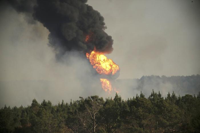 Flames shoot into the sky from a gas line explosion in western Shelby County, Alabama, U.S., October 31, 2016. REUTERS/Marvin Gentry